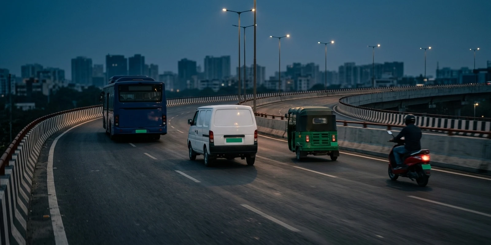 Electric bus, delivery van, auto-rickshaw and scooter on an Indian flyover at dusk, representing India's EV ecosystem report 2026
